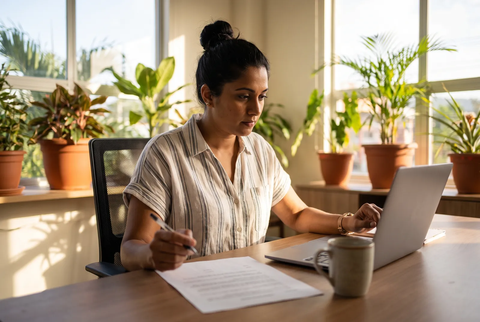 Business owner planning her website at a laptop